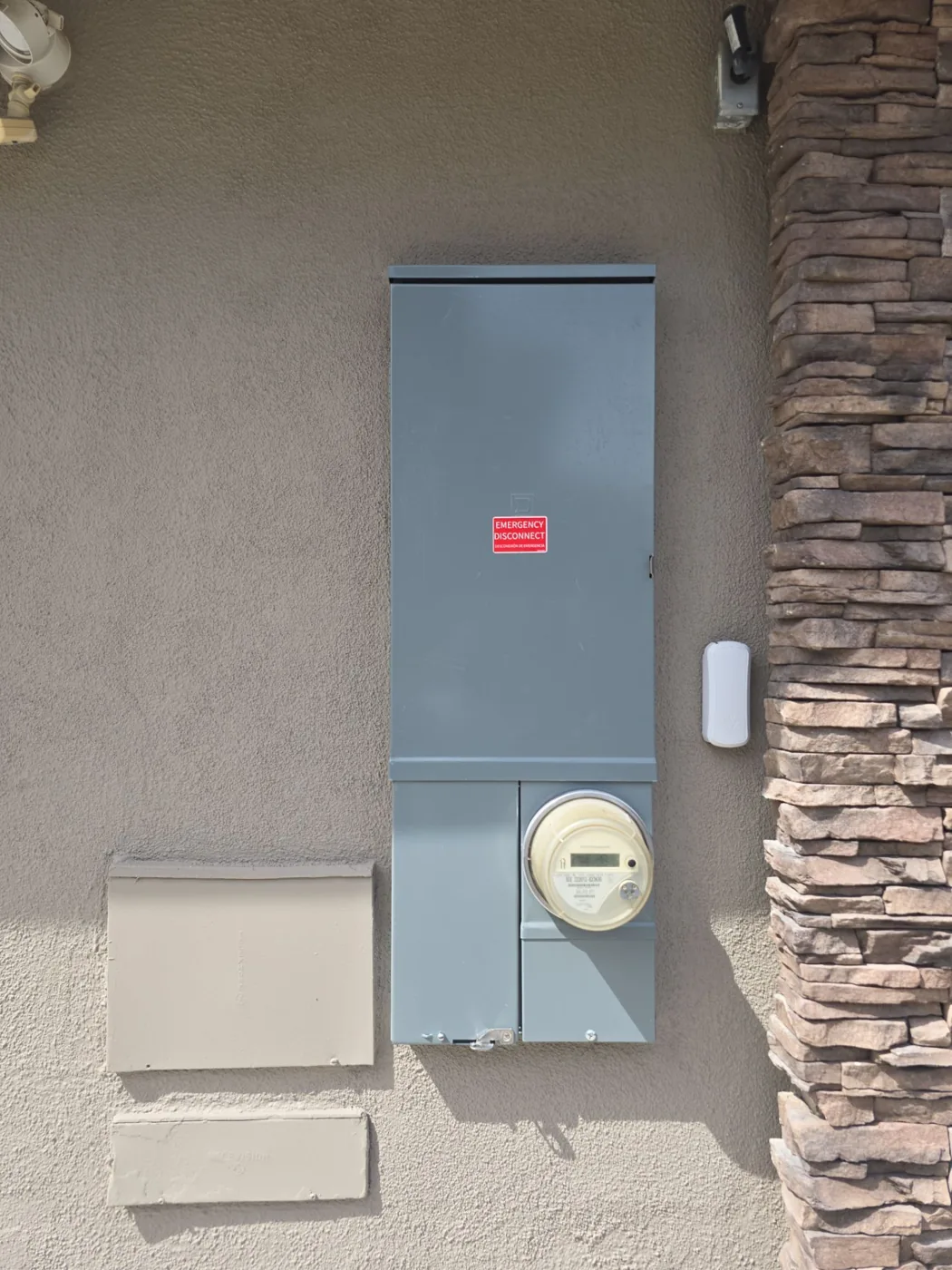 Finished electrical panel and surrounding wall.