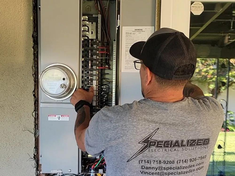 SES technician working at a residential electrical service panel